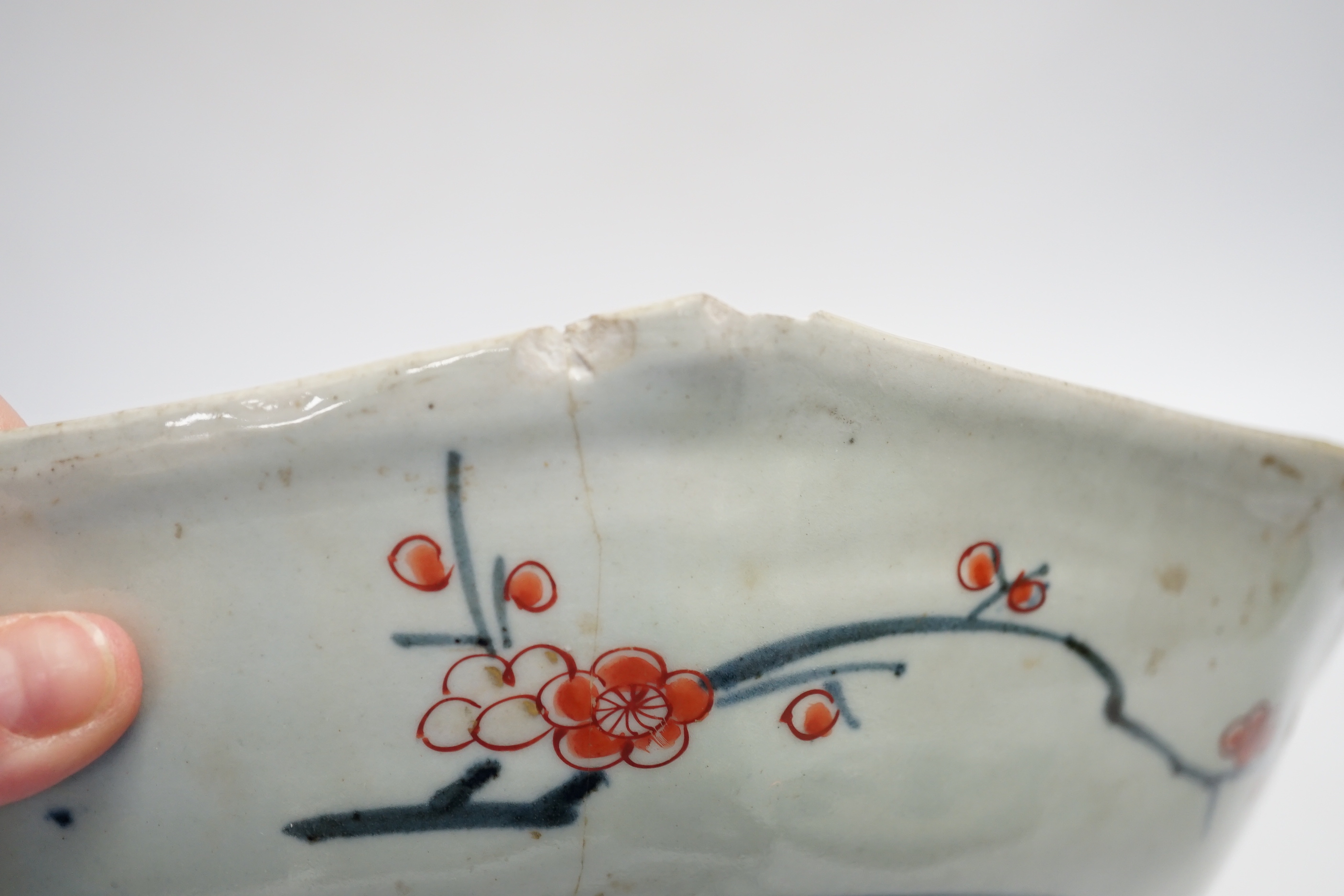 A late 17th/early 18th century Japanese Arita dish (a.f) and two other Arita pieces, largest 27cm